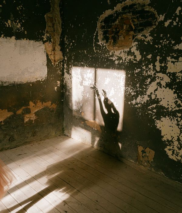Person stretching in a bright, sunlit room, feeling full of vitality.